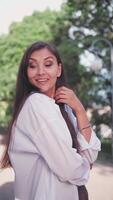 Portrait beautiful smiling girl looking smiling at camera. Happy woman. The concept of tenderness. Flirting, flirtatious. Vertical format for the phone. video