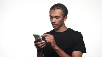 Excited man using smartphone on white background video
