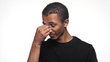 Man Pinching Nose Symbolizing Headache on White Background video
