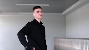 Smiling caucasian businesman in formal outfit looking at camera standing in office. Portrait of happy handsome man wearing suit in open space. Confident corporate worker posing. video