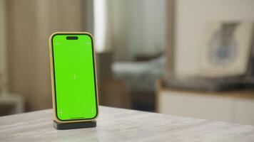 Smartphone with Chroma Key Screen on Table in Minimalist Room video