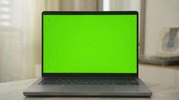 Laptop with Green Screen and Copy Space on Table video