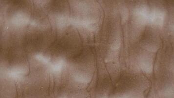 Chocolate bare rotate texture with abstract marble waves lines, close up. Milk chocolate texture as abstract wallpaper background. Sweet food concept video