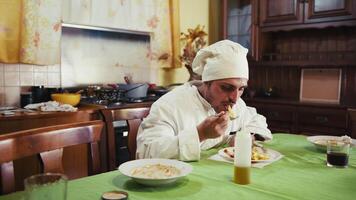 Happy Chef Enjoying Dinner Smiling Sitting At Table And Chatting With Friends indoor video