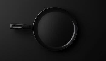 Black iron frying pan flat lay on dark background photo