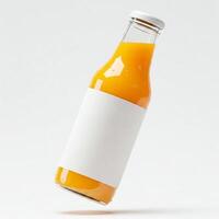 A glass bottle of orange juice with a plain white mock label isolated on white photo