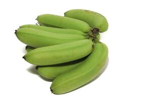 A green banana, after harvest, in a woven bamboo container, panen pisang cavendish, pisang ambon hijau, dari kebun, Ambon bananas, sweet, savory and a little sour, after harvest, rasanya manis gurih photo