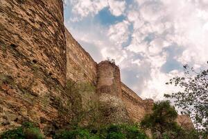 View of the fortress in Tbilisi from the botanical garden. High walls in Tbilisi. photo