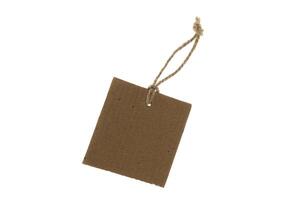 Blank and empty cardboard price tag tied with string isolated on white background with clipping path photo