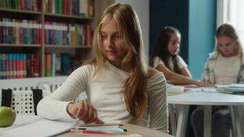Caucasian girl school pupil gen z student schoolgirl child kid teenager write test exam pretend studying writing copy task solution exercise using mobile phone chatbot internet virtual AI assistant video