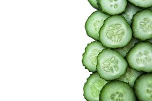 stack of sliced cucumbers on white background photo