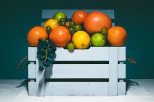 Fresh Citrus Fruits in Wooden Crate photo