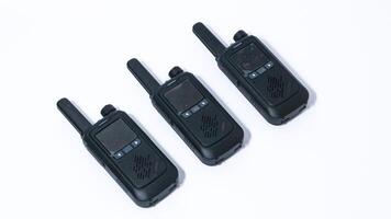 Black portable radio ht or walkie talkie in a white background photo