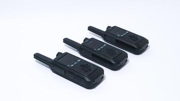 Black portable radio ht or walkie talkie in a white background photo