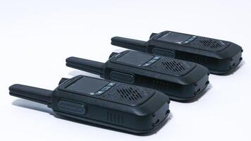 Black portable radio ht or walkie talkie in a white background photo