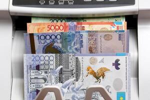 Kazakhstani tenge in the counting machine photo