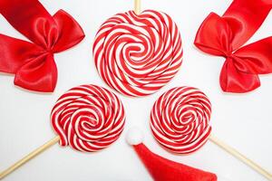 Flatlay of some red Christmas decoration, on a white background. Background for Christmas. photo