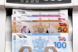 Trinidad and Tobago dollar in the counting machine photo