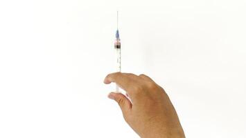 Vial of Drug or Vaccine and 3 ml Plastic Syringe with Needle Isolated on the White Background, blue tone color photo