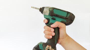Cordless drill with drill bits, white background for copy space. photo