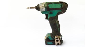 Cordless drill with drill bits, white background for copy space. photo