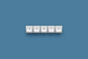 Earth text on a 3d keyboard button with shadow concept series photo