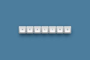 Healing text on a 3d keyboard button with shadow concept series photo