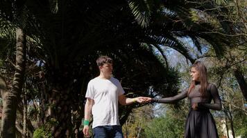A Romantic Interaction in a Beautiful Lush Garden Setting with Vibrant Natural Surroundings video