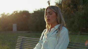 Busy Doctor Tries To Get Some Rest On A Bench video