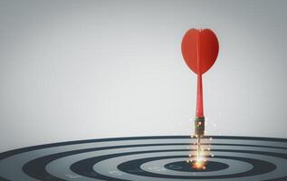 Bullseye target goal or dartboard has dart arrow throw hitting center shooting for financial business targeting planning to winner concept. photo