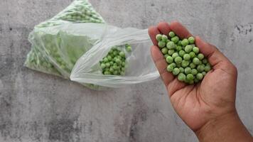 Fresh green peas being sorted for cooking preparation video