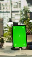 Vertical Close up of isolated screen tablet used by worker in office reviewing financial graphs. Employee looking over data trends and strategic insights on mockup tablet, analyzing KPIs, camera B video