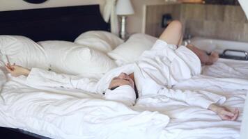 Relaxation morning routine in a cozy bedroom with soft linens and natural light video