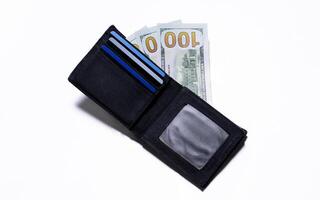 Banknote in black wallet isolated on white background. After edits. photo