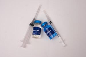 top view of vaccines and syringes on the table inside the clinic room. health and medical concepts photo