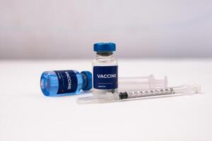 vaccines and syringes on the table inside the clinic room. health and medical concepts photo