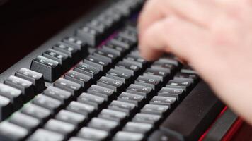 A person is typing on a computer keyboard video
