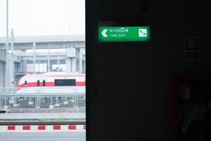 Emergency exit sign on the platform of the railway repair station. photo