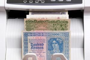 Old Austrian crown in the counting machine photo