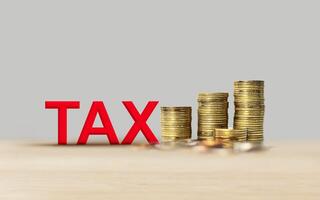 Income tax from 3D volumetric letters with stacked coins. Visualization of tax charging and payment in business photo