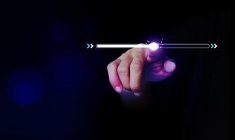 Finger touching on download bar status. Starting a new business on a purple dark background photo