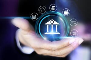 businessman holding virtual bank icon on virtual background photo
