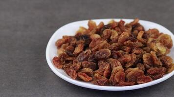 A bowl of raisins sitting on a table video