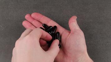 A person holding a black object in their hand video