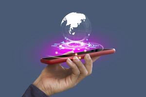 Holding smartphone with virtual Global Internet connection. Global internet connection application technology and digital marketing, Financial and banking, Digital link tech, big data. photo