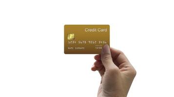 Hand-holding golden credit card with a chip over white promo background with copy space for text. High-quality photo