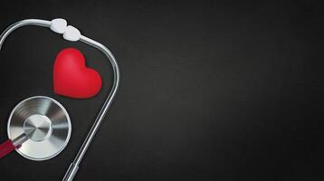 Red heart with stethoscope on stone background, heart health, health insurance concept, World heart day, world health day, doctor day, world hypertension day photo