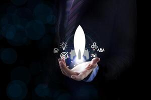 Startup business concept, Businessman control white rocket. Fast business success. Network connection on city background. photo