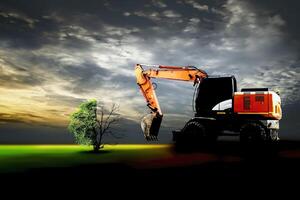 loader is trying to cut down a tree for construction photo