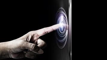 a person touching a button on a touch screen photo